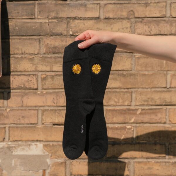 Synix Girasole sustainable socks in black with golden sunflower embroidery